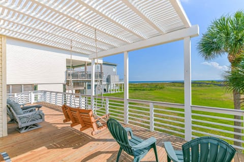 Enjoy views and your morning coffee on this spacious deck with plenty of seating, and porch swing.