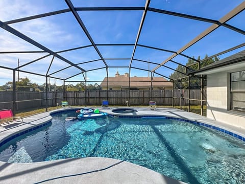 Heated Pool and Spa/Jacuzzi with toys floating devices,  beach chairs and mosquito net fence for confort.