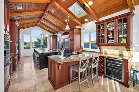 Bar stools for additional seating and a wine fridge