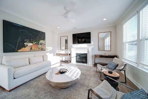 Bright, open living space with natural light, Smart TV, and free Wi-Fi just minutes from Uptown Charlotte.