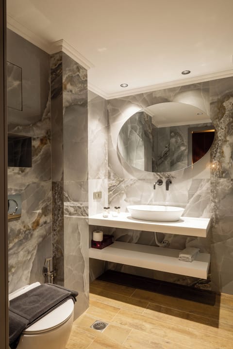 Basic Studio Suite, Balcony, City View | Bathroom | Shower, hair dryer, slippers, towels