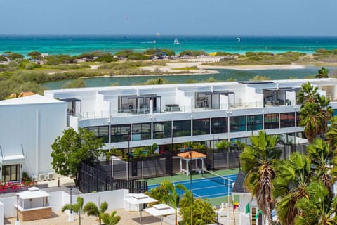 Where the courts meet the Caribbean. Experience the ultimate island lifestyle with world-class tennis, a luxury pool, and breathtaking ocean views—all in one exclusive location. Your paradise found at Aruba Racquet Club.