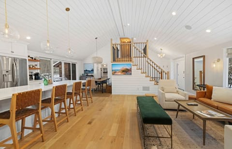 Open sightlines from kitchen to lounges make hosting seamless.