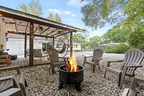 Relax by the fire pit on the covered patio—perfect for evening gatherings.