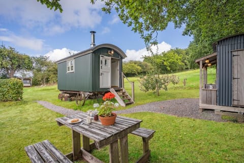 Set in a peaceful meadow with views over the surrounding countryside