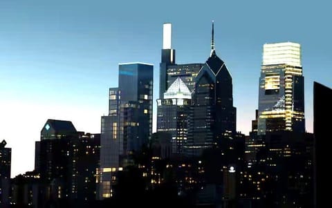 View of downtown center city through huge window, with your wine glass in hand.