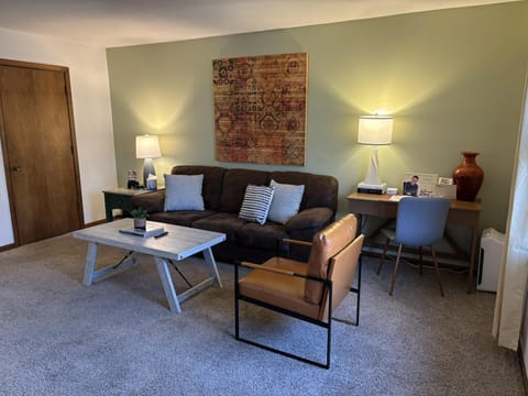 Cozy living room with stylish seating and warm lighting
