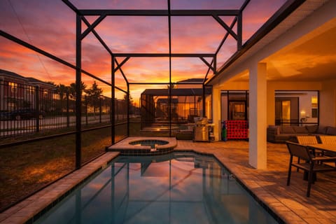 Enjoy beautiful Florida sunsets from the outdoor patio by your private pool.