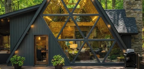 Welcome to Timber & Glass: Wake up to floor‑to‑ceiling forest views, cozy designer interiors, and your own private summer retreat.