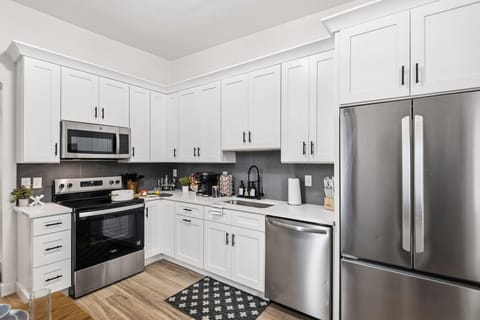 Modern Kitchen & Dining: This bright space offers essential amenities like a dishwasher, coffee maker, and full-size fridge —everything you need for a convenient and charming stay!