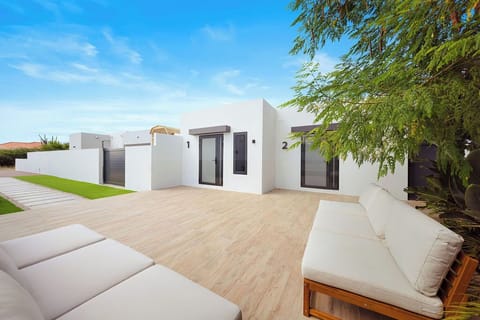 Stunning Grounds: Enjoy the lush, palm-lined entrance and stylish, outdoor seating areas—the ideal setting for relaxation after a day of exploring.