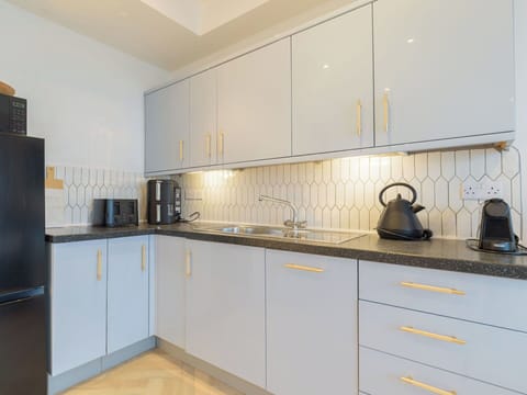 Kitchen, Countertop, Kitchen Appliance, Major Appliance, Cabinetry, Flooring, Interior Design, Wood, Kitchen Stove, Floor