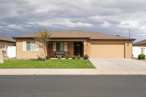 Front view of home features covered patio area.