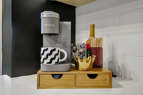 fully stocked coffee bar w/ Keurig k-cups, sugar, creamer, syrup & assorted teas