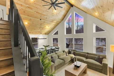Bright A-Frame Living Room with Floor-to-Ceiling Windows