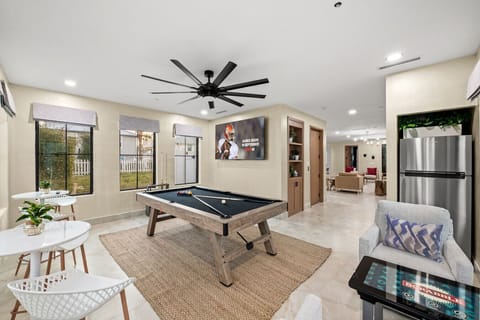 Play some video games or a game of pool in the den area.