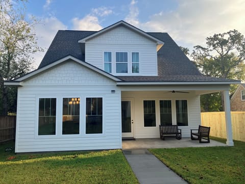Back of home with large rear porch