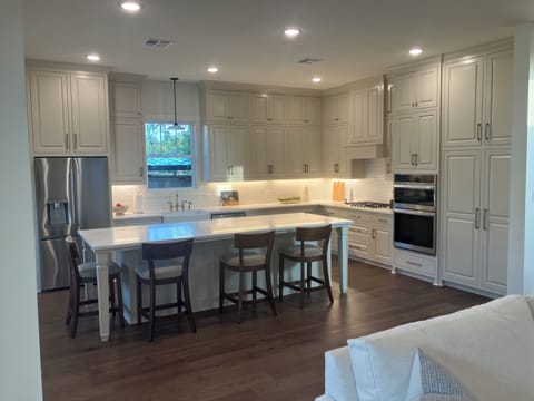 Large open kitchen with bar seating for 4