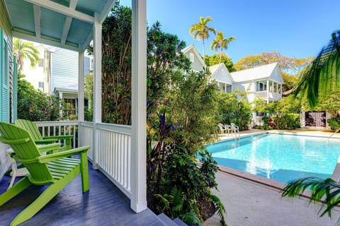 Start your day at Life Is A Breeze relaxing on the front porch with a cup of coffee while enjoying peaceful views of the shared pool.