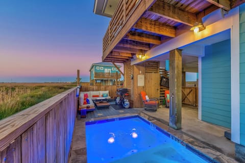 Private cocktail pool, seating area and views of the wetlands from the back porch