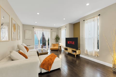 Spacious living room with a 65 inch smart TV. We also have board games provided!
