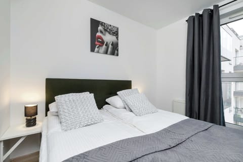 Soft lighting enhances the comfort of the double bed, creating a soothing place to unwind after a day full of experiences.