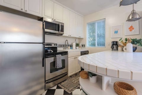 Fully equipped kitchen featuring modern appliances and stylish finishes