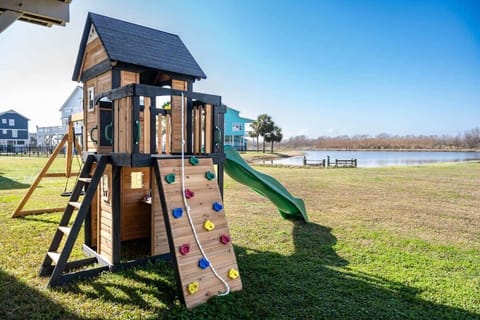 Outdoor Fun Zone: Adventure awaits on this playset with stunning lake views and endless excitement!
