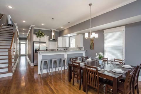 Kitchen: Sun-filled and social! The kitchen flows seamlessly into the dining space, creating a welcoming atmosphere for gatherings.