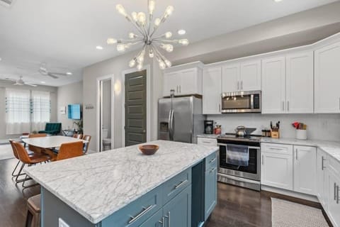 Kitchen: A modern kitchen with sleek finishes and updated appliances.