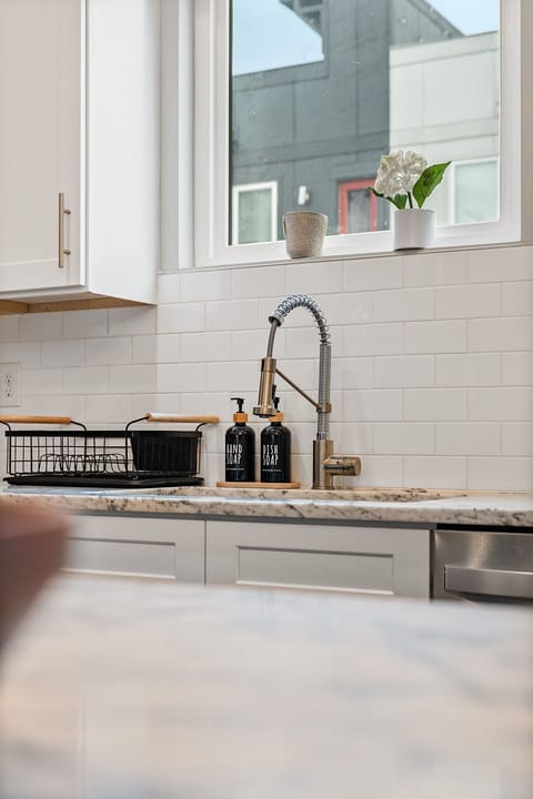 Kitchen: A modern kitchen with sleek finishes and updated appliances.