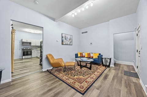 Living Area: This living room features sturdy, practical furniture built for extended use, ensuring longevity and comfort for families or traveling colleagues. Our home's clean, open layout offers maximum functional flexibility.