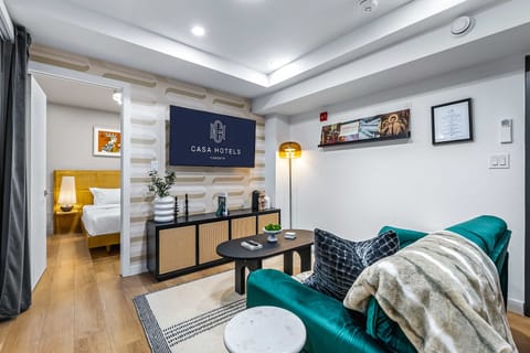 Bright & stylish living room with a comfortable sofa bed and smart TV.