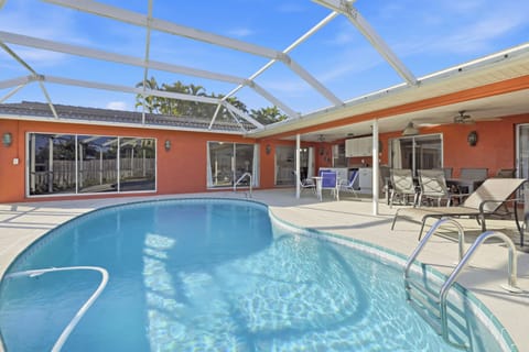Relax by this heated pool and watch the dolphins