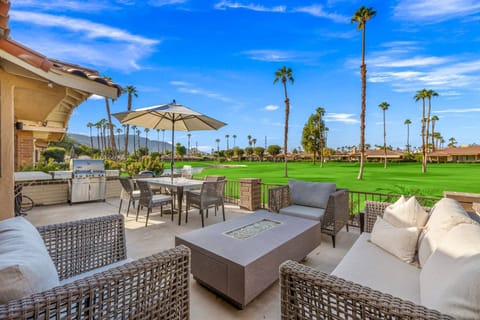 From sunny fairway views to cozy nights by the fire—this patio oasis has it all!