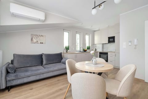 Living room with modern sofa and cozy decor.