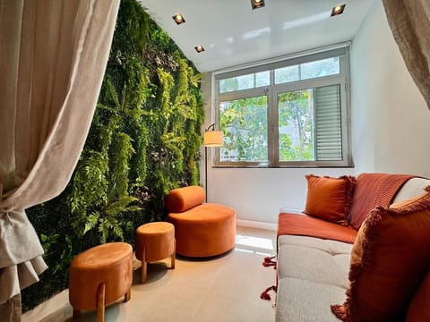 Deluxe Apartment, Beach View | Living area | 65-inch Smart TV with digital channels, Netflix, streaming services