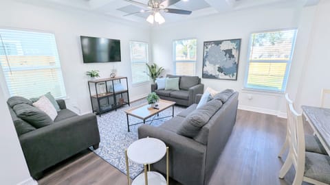 Relax in this amazing living space that flows into the kitchen and dining areas. 
