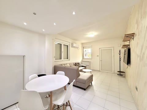 Comfort Apartment, Patio | Living area | 42-inch LCD TV with satellite channels