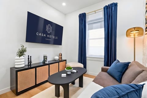 Bright living area with Smart TV and comfortable seating.