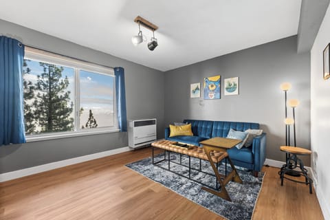 The downstairs king bedroom features an additional living room with a smart TV, workspace and ensuite bathroom. 