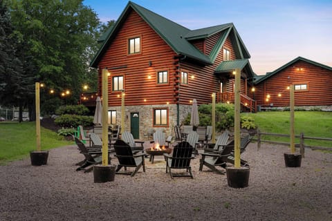 Our exterior has a 12 chair fire pit with string lights, two dining sets w/ 12 chairs, gas grill, and outdoor yard games.