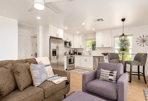 Wide open floor plan connects full kitchen and living room. Lots of windows for a bright airy feel. 
