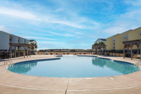 Relax at the Surf Condos’ spacious seasonal pool—perfect for sunny Carolina days!