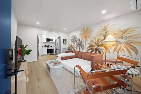 Open living space with mural and modern furniture.