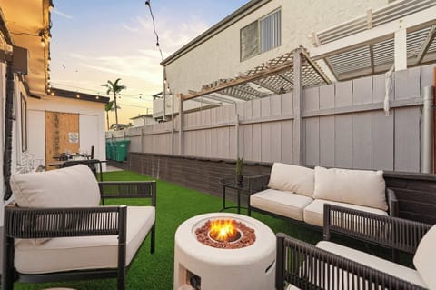 Inviting outdoor lounge complete with fire pit seating for nighttime relaxation.