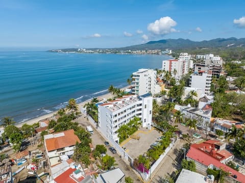 Take in sweeping views of the coastline, surrounding neighborhoods, and the sparkling Pacific Ocean from this exceptional beachfront setting.