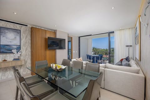 Gather in the bright open-concept living and dining space, thoughtfully designed for comfort, relaxation, and effortless indoor-outdoor living.