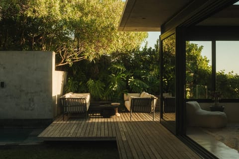 Terrace area and pool/garden leading from bedroom 2
