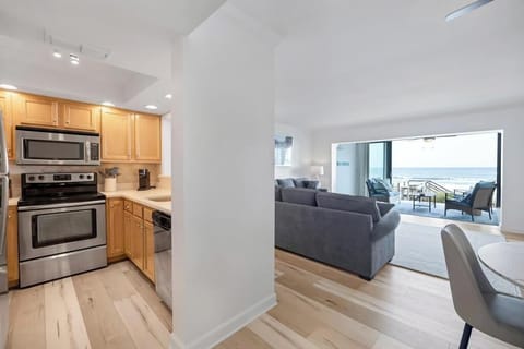 Kitchen flows seamlessly into the living area for easy gathering.